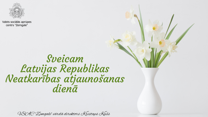 Apsveikums. Balti zaļās krāsās, uz galda balta vāze ar baltām narcisēm. Uzraksts "Sveicam Latvijas Republikas Neatkarības atjauno;sanas dienā!""